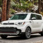 white 2019 Kia Soul with red and black accents